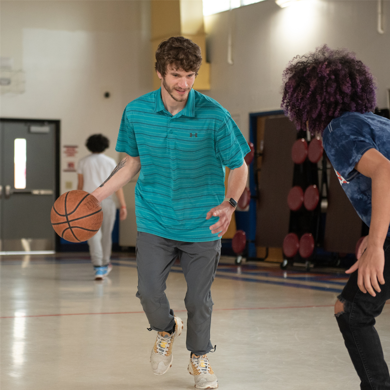 Student holding a ball